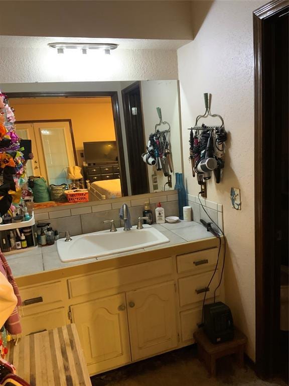 2709 Timber Ct, Chickasha, OK 73018 - bathroom with a textured wall and vanity