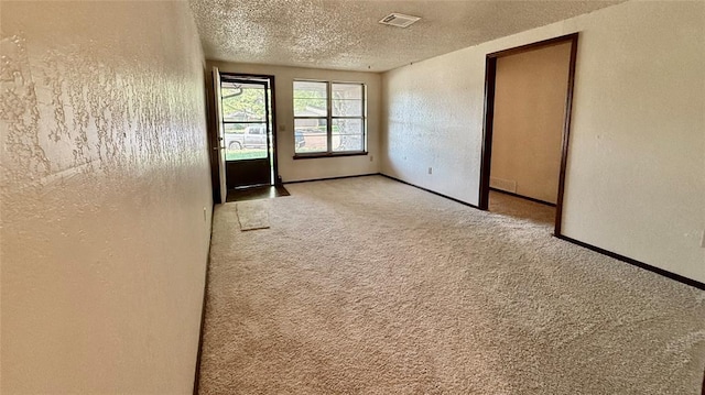 3308 Resh Ct, Norman, OK 73072 - unfurnished room featuring carpet floors, a textured ceiling, and a textured wall
