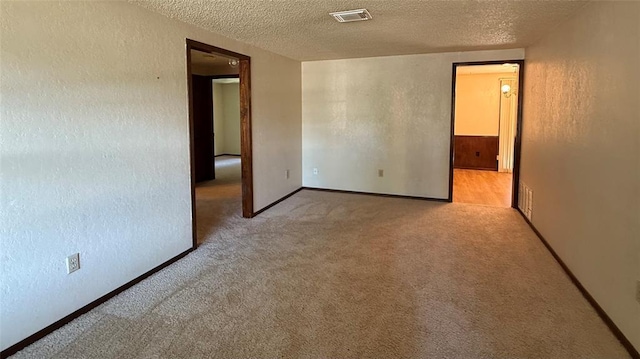 3308 Resh Ct, Norman, OK 73072 - carpeted empty room with a textured ceiling and a textured wall