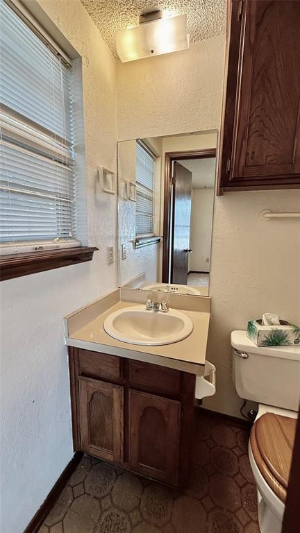 3308 Resh Ct, Norman, OK 73072 - bathroom featuring a textured wall and vanity