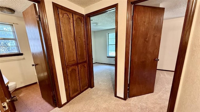 3308 Resh Ct, Norman, OK 73072 - hall with a textured ceiling and baseboards