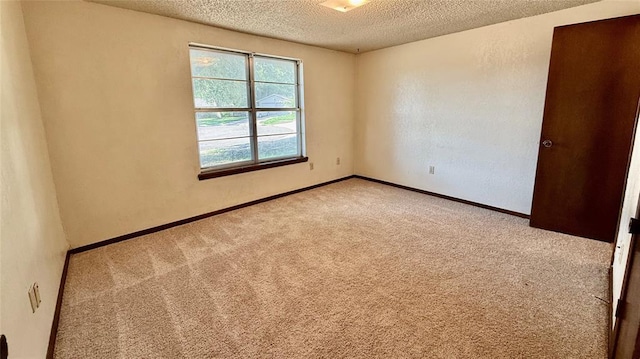 3308 Resh Ct, Norman, OK 73072 - carpeted empty room with a textured ceiling and baseboards