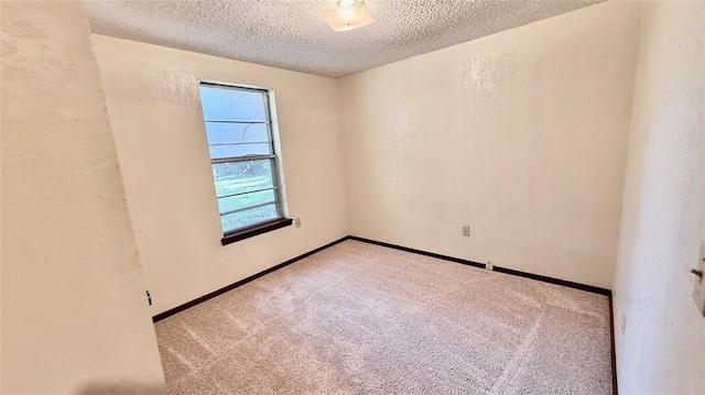 3308 Resh Ct, Norman, OK 73072 - empty room featuring a textured ceiling and carpet