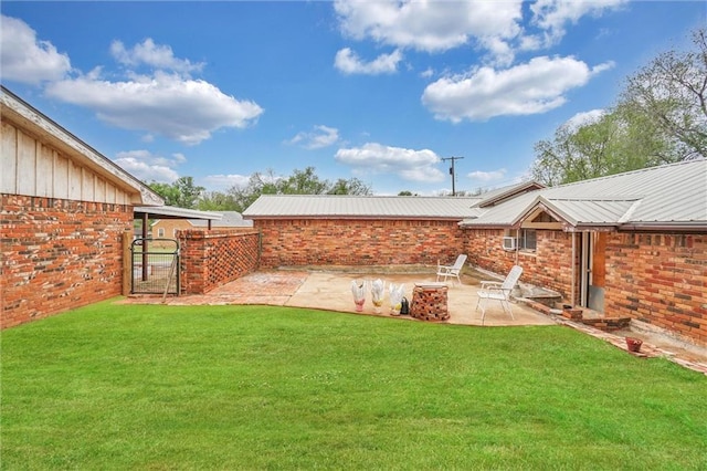 207 E Pine Ave, Sayre, OK 73662 - view of yard with a patio area, a gate, and an outdoor fire pit