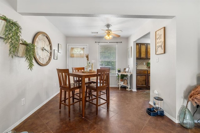 275 S Ranchette Rd, Mead, OK 73449 - dining space with ceiling fan and dark tile patterned floors