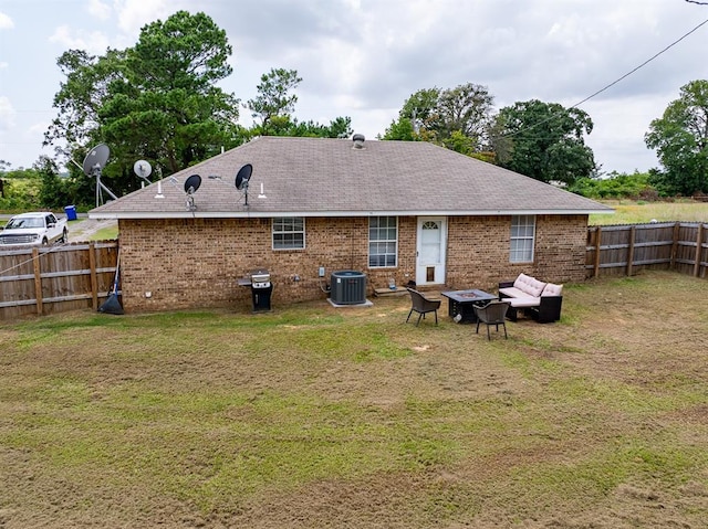 275 S Ranchette Rd, Mead, OK 73449 - back of house featuring a fenced backyard, a fire pit, brick siding, and a shingled roof