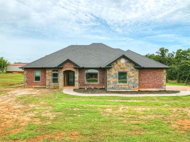 19855 Walker Rd, Mcloud, OK 74851 - view of front of property featuring stone siding, a front lawn, and a shingled roof