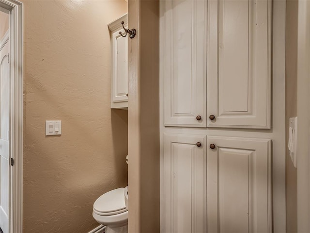 19855 Walker Rd, Mcloud, OK 74851 - bathroom with toilet and a textured wall
