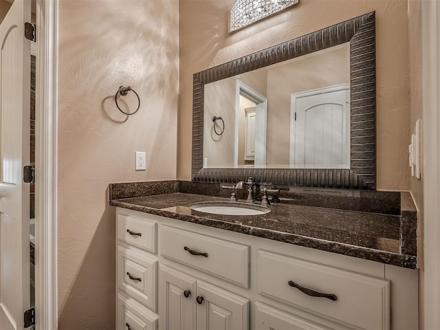 19855 Walker Rd, Mcloud, OK 74851 - bathroom featuring vanity and a textured wall