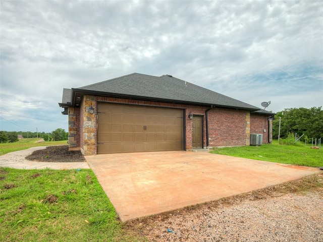 19855 Walker Rd, Mcloud, OK 74851 - view of home's exterior with driveway, a garage, a lawn, a shingled roof, and brick siding