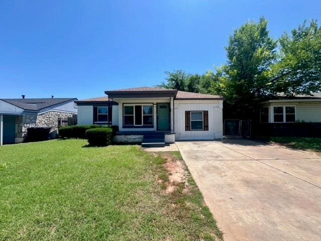 4020 NW 28th St, Oklahoma City, OK 73107 - view of front of home with a front yard and concrete driveway