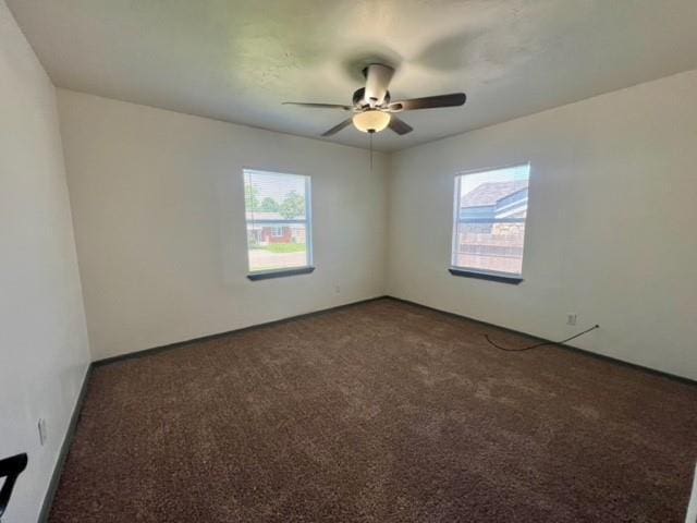 4020 NW 28th St, Oklahoma City, OK 73107 - carpeted empty room featuring healthy amount of natural light and ceiling fan