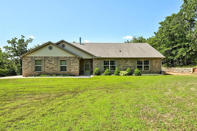 19100 SE 134th St, Mcloud, OK 74851 - ranch-style house with a front yard and brick siding