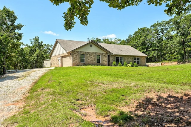 19100 SE 134th St, Mcloud, OK 74851 - ranch-style house with gravel driveway, an attached garage, and a front lawn