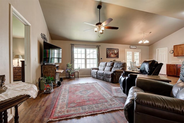 19100 SE 134th St, Mcloud, OK 74851 - living area featuring vaulted ceiling, a ceiling fan, wood finished floors, and a chandelier