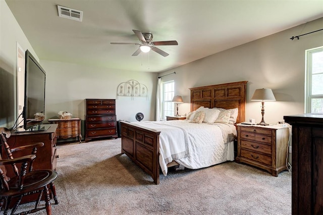 19100 SE 134th St, Mcloud, OK 74851 - bedroom with light colored carpet, multiple windows, and a ceiling fan