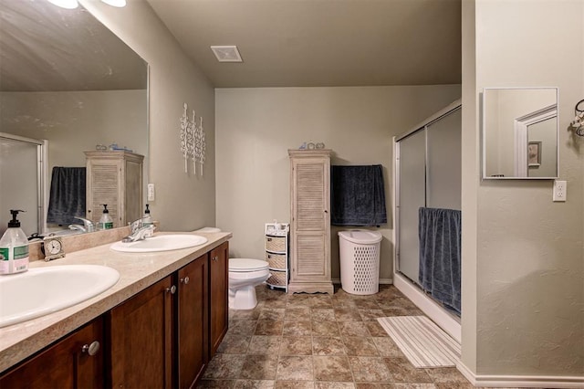 19100 SE 134th St, Mcloud, OK 74851 - bathroom featuring a shower stall, double vanity, and stone finish flooring