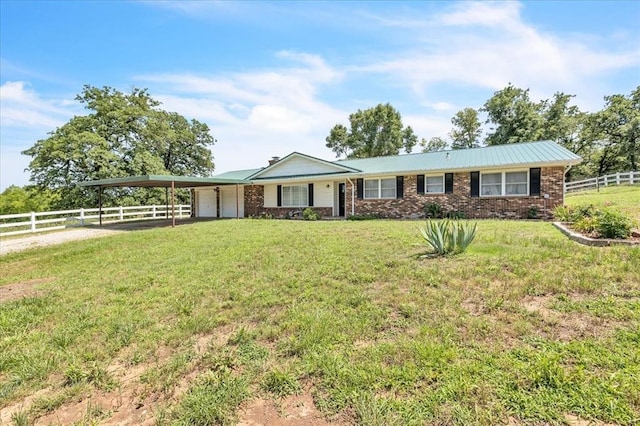331249 E 1020th Rd, Harrah, OK 73045 - single story home with a garage, a carport, driveway, brick siding, and a metal roof