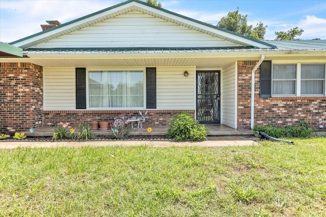 331249 E 1020th Rd, Harrah, OK 73045 - view of front of home featuring brick siding and a front lawn