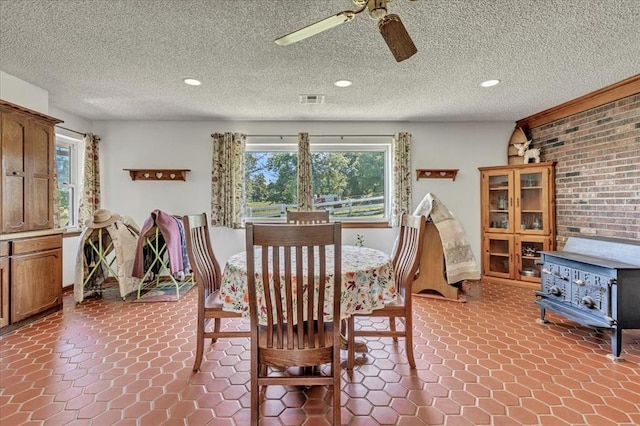 331249 E 1020th Rd, Harrah, OK 73045 - dining room featuring a wood stove, a ceiling fan, and recessed lighting