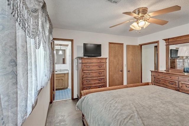 331249 E 1020th Rd, Harrah, OK 73045 - bedroom with concrete floors, ceiling fan, and ensuite bath