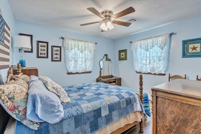 331249 E 1020th Rd, Harrah, OK 73045 - bedroom with ceiling fan and a textured ceiling