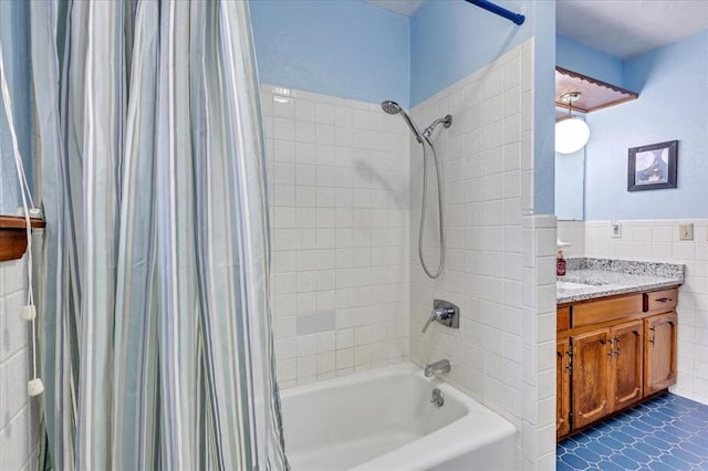 331249 E 1020th Rd, Harrah, OK 73045 - bathroom with shower / bath combo, tile walls, vanity, and wainscoting