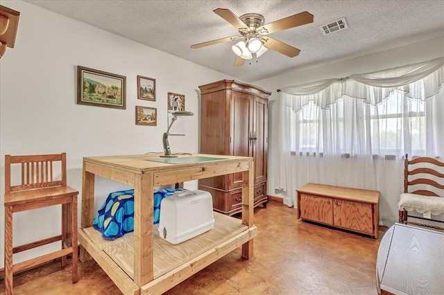 331249 E 1020th Rd, Harrah, OK 73045 - bedroom with a textured ceiling, a desk, and concrete flooring