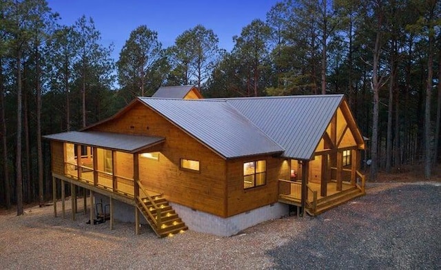 1723 Pine Hills Rd, Broken Bow, OK 74728 - view of front of property featuring crawl space, a metal roof, and a porch