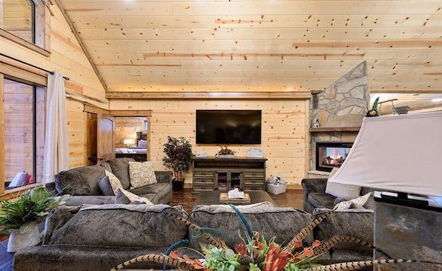 1723 Pine Hills Rd, Broken Bow, OK 74728 - living area featuring wood ceiling, lofted ceiling, wood finished floors, wooden walls, and a stone fireplace
