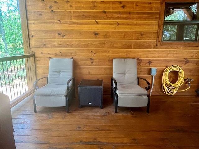 1723 Pine Hills Rd, Broken Bow, OK 74728 - sitting room with wood-type flooring and wood walls