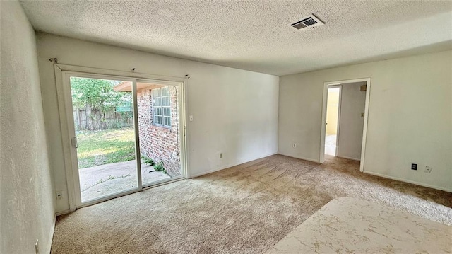 2719 Osage Way, Norman, OK 73071 - carpeted empty room with a textured ceiling