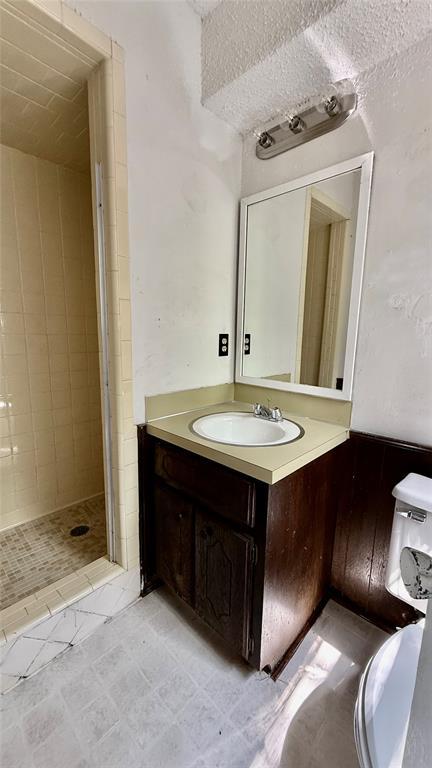 2719 Osage Way, Norman, OK 73071 - bathroom featuring a stall shower and vanity