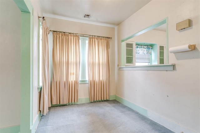121 NW 26th St, Oklahoma City, OK 73103 - carpeted spare room featuring baseboards