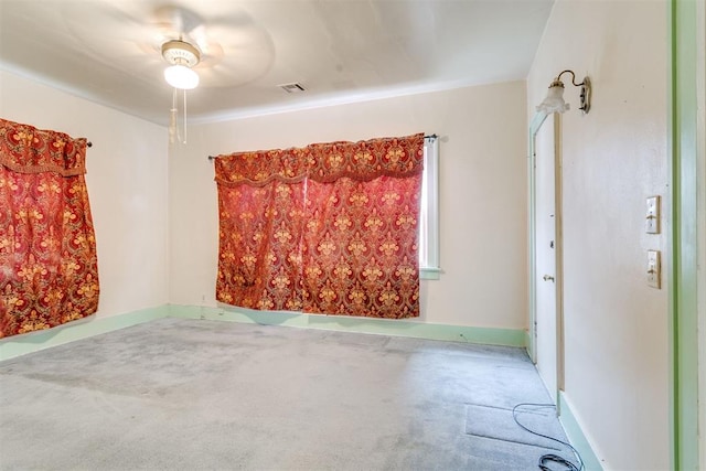 121 NW 26th St, Oklahoma City, OK 73103 - carpeted spare room featuring baseboards and a ceiling fan