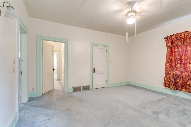 121 NW 26th St, Oklahoma City, OK 73103 - unfurnished room featuring light colored carpet and ceiling fan