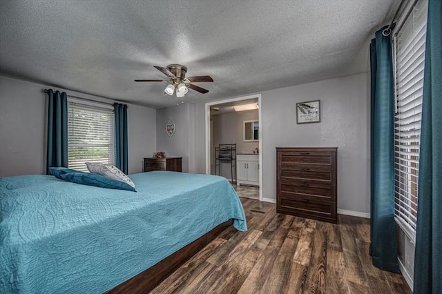 6550 N Indian Meridian Rd, Coyle, OK 73027 - bedroom featuring wood finished floors, a textured ceiling, ensuite bathroom, and a ceiling fan