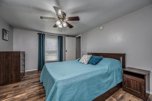 6550 N Indian Meridian Rd, Coyle, OK 73027 - bedroom with wood finished floors, a textured ceiling, and ceiling fan