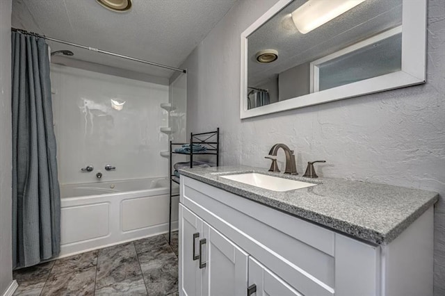 6550 N Indian Meridian Rd, Coyle, OK 73027 - bathroom with vanity, shower / bathtub combination with curtain, a textured wall, and a textured ceiling