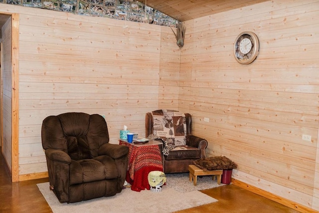 12223 N 2040th Rd, Sentinel, OK 73664 - sitting room with wood walls, concrete floors, wooden ceiling, and vaulted ceiling