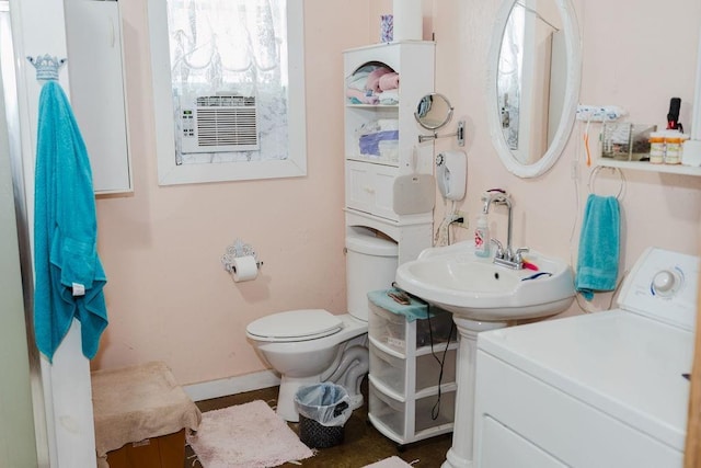 12223 N 2040th Rd, Sentinel, OK 73664 - bathroom featuring washer / dryer and baseboards