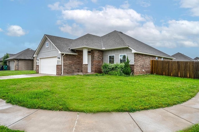 4217 NW 151st St, Edmond, OK 73013 - view of front of home featuring board and batten siding, concrete driveway, and brick siding