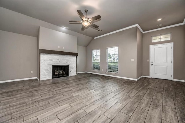 4217 NW 151st St, Edmond, OK 73013 - unfurnished living room with ceiling fan, wood finished floors, a fireplace, lofted ceiling, and ornamental molding