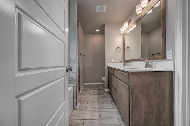 4217 NW 151st St, Edmond, OK 73013 - full bathroom featuring double vanity, recessed lighting, and a tub to relax in