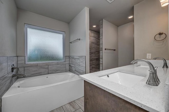4217 NW 151st St, Edmond, OK 73013 - full bath featuring a garden tub, vanity, and recessed lighting