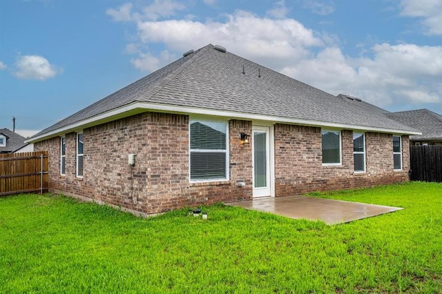4217 NW 151st St, Edmond, OK 73013 - back of house with roof with shingles, a patio, and brick siding