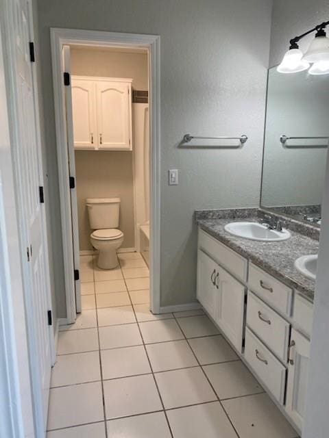 7700 139th St, Noble, OK 73068 - bathroom featuring double vanity, tile patterned floors, and shower / tub combo