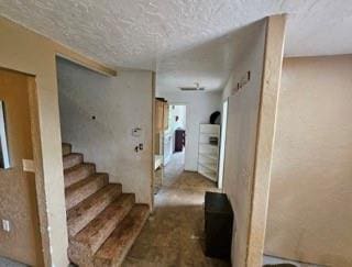 7700 139th St, Noble, OK 73068 - staircase featuring a textured ceiling
