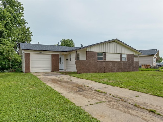 2837 SW 63rd St, Oklahoma City, OK 73159 - ranch-style home with an attached garage, brick siding, driveway, board and batten siding, and a front lawn