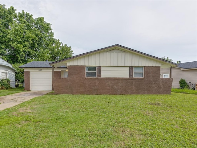 2837 SW 63rd St, Oklahoma City, OK 73159 - view of side of property with driveway, brick siding, an attached garage, and a lawn